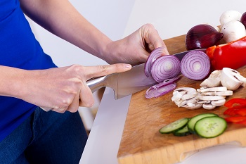 Person chopping onions